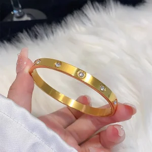 Visconte | Brede titanium vergulde gouden armband met tien diamanten